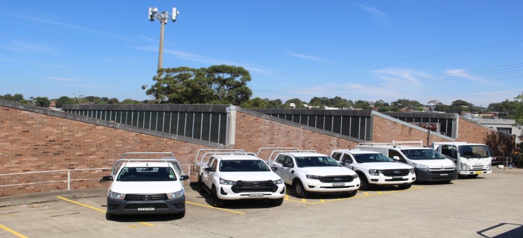 parked tradie vehicles including utes, vans and trucks