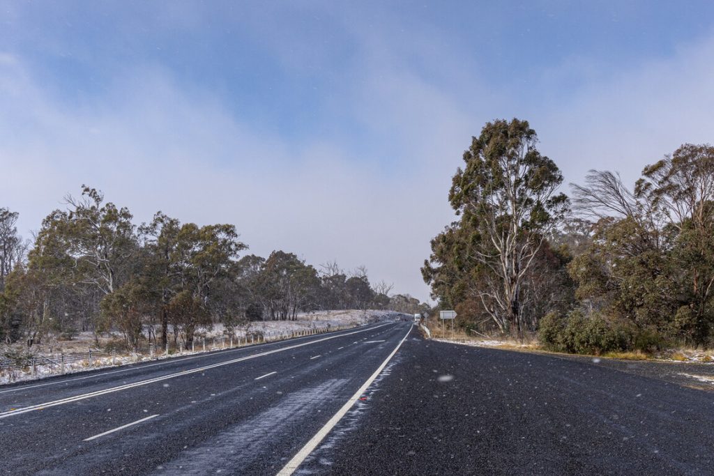 winter road in australia with snow on ground