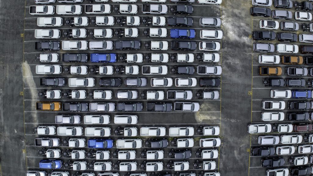 aerial shot of several utes parked in a storage lot